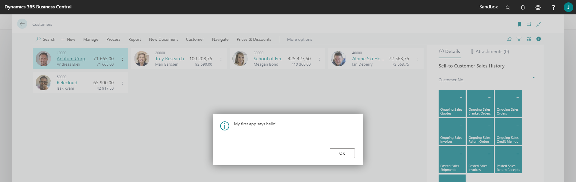 A dialog box with the message "My first app says hello!"
